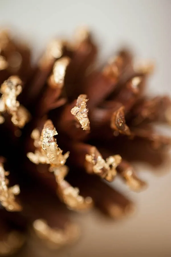 DIY gold leaf pine cone garland from The Sweetest Occasion | Photo by Alice G Patterson