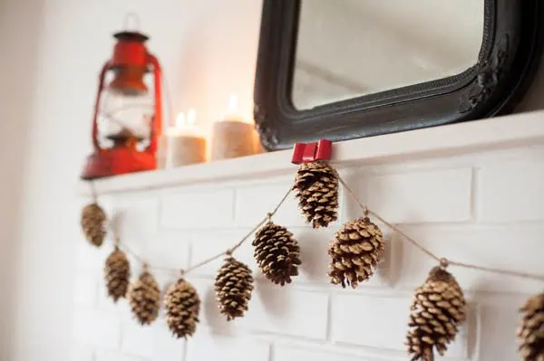 DIY gold leaf pine cone garland from The Sweetest Occasion | Photo by Alice G Patterson