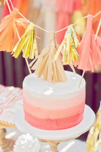 A peach, coral + gold first birthday party