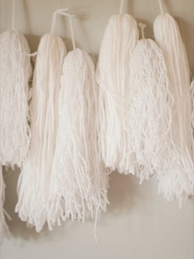 DIY Yarn Tassel Garland + Pom Pom Napkin Rings thumbnail
