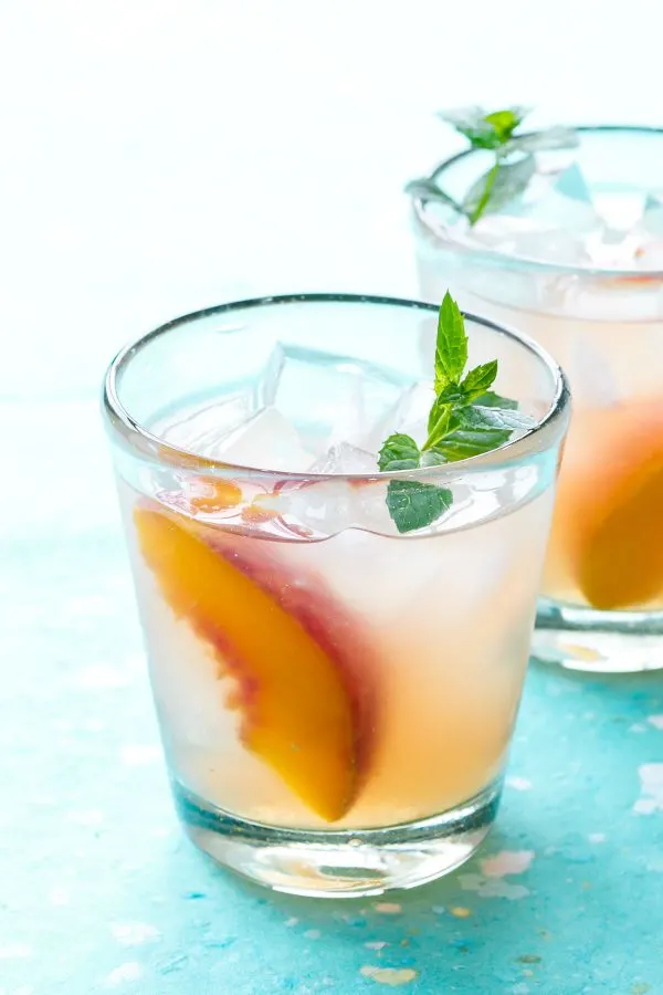 Bourbon Peach Sangria | 15 Sangria Recipes for Late Summer and Fall | Cocktail recipes, entertaining tips and party ideas from @cydconverse