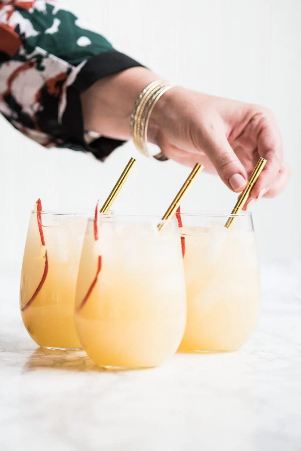 Fizzy Spiked Pear Punch Champagne Cocktail | Cocktail recipes, entertaining ideas, party recipes, party ideas and more from @cydconverse