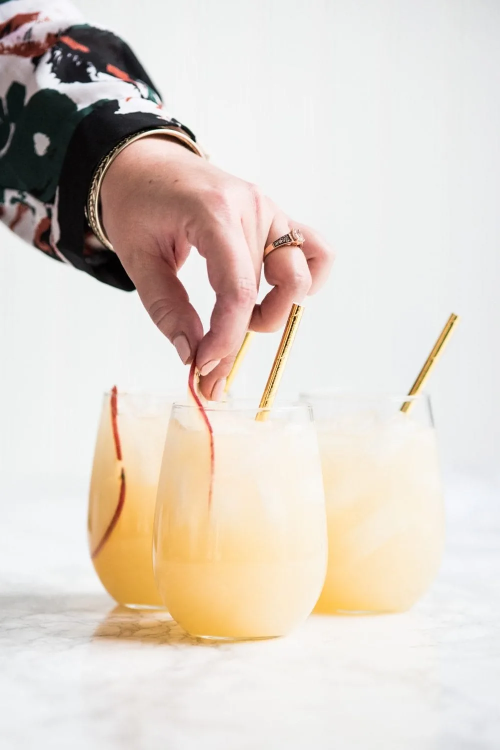 Fizzy Spiked Pear Punch Champagne Cocktail | Cocktail recipes, entertaining ideas, party recipes, party ideas and more from @cydconverse