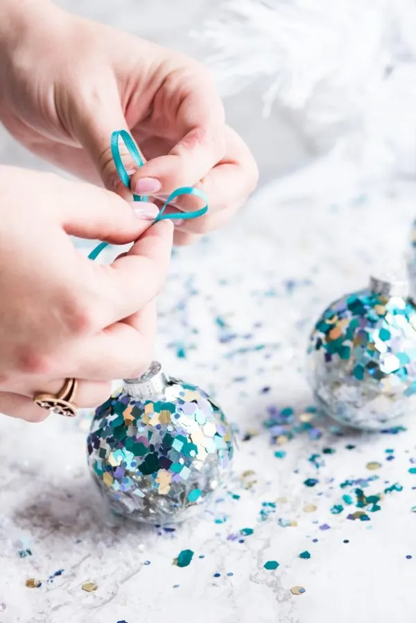 DIY Glitter Confetti Ornaments | Christmas craft ideas, homemade ornaments, Christmas recipes and more from @cydconverse