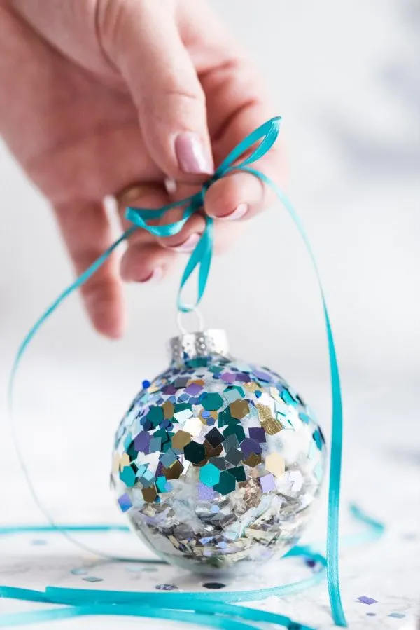 DIY Glitter Confetti Ornaments | Christmas craft ideas, homemade ornaments, Christmas recipes and more from @cydconverse