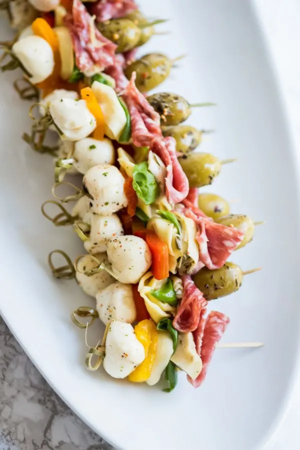 Easy Party Appetizers - Antipasto Skewers | Appetizer recipes, cocktail recipes, entertaining tips and party ideas from @cydconverse