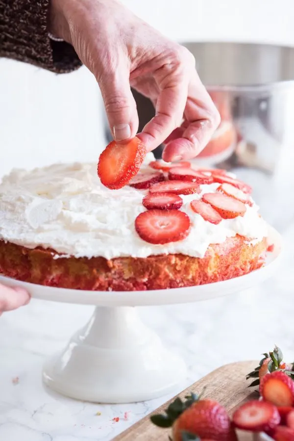 Strawberry Poke Cake with Berries + Cream | Birthday cake recipes, poke cake recipes, party appetizers, entertaining tips, birthday party ideas and more from @cydconverse