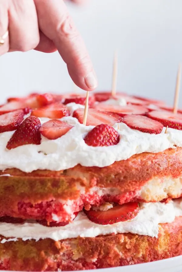 Strawberry Poke Cake with Berries + Cream | Birthday cake recipes, poke cake recipes, party appetizers, entertaining tips, birthday party ideas and more from @cydconverse