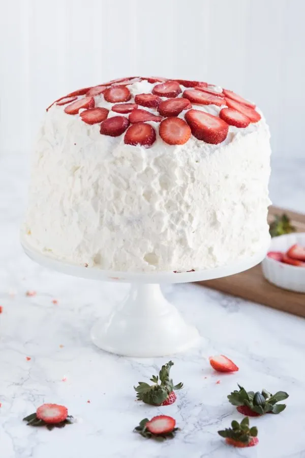 Strawberry Poke Cake with Berries + Cream | Birthday cake recipes, poke cake recipes, party appetizers, entertaining tips, birthday party ideas and more from @cydconverse