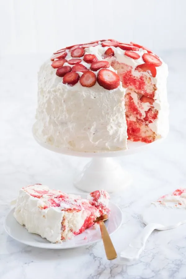 Strawberry Poke Cake with Berries + Cream | Birthday cake recipes, poke cake recipes, party appetizers, entertaining tips, birthday party ideas and more from @cydconverse