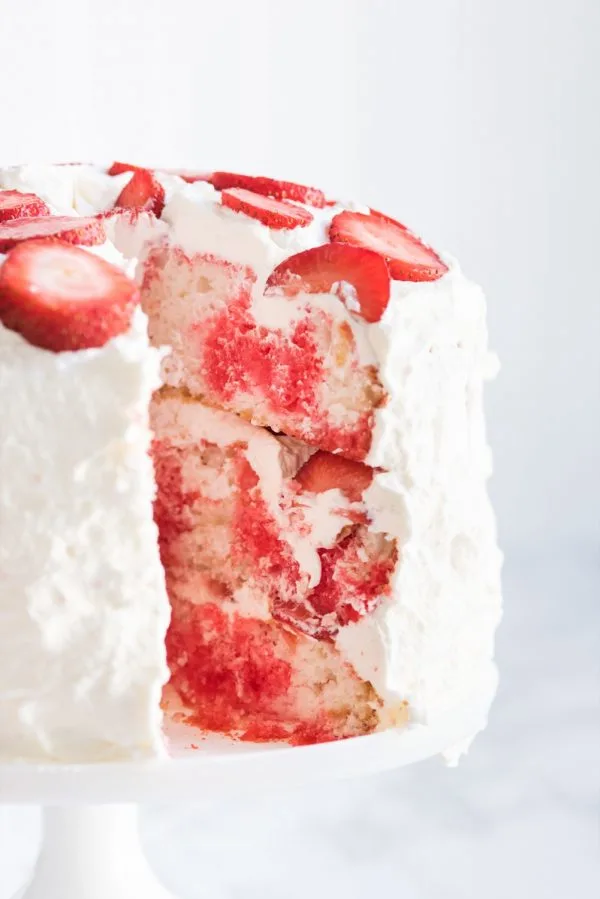 Strawberry Poke Cake with Berries + Cream | Birthday cake recipes, poke cake recipes, party appetizers, entertaining tips, birthday party ideas and more from @cydconverse