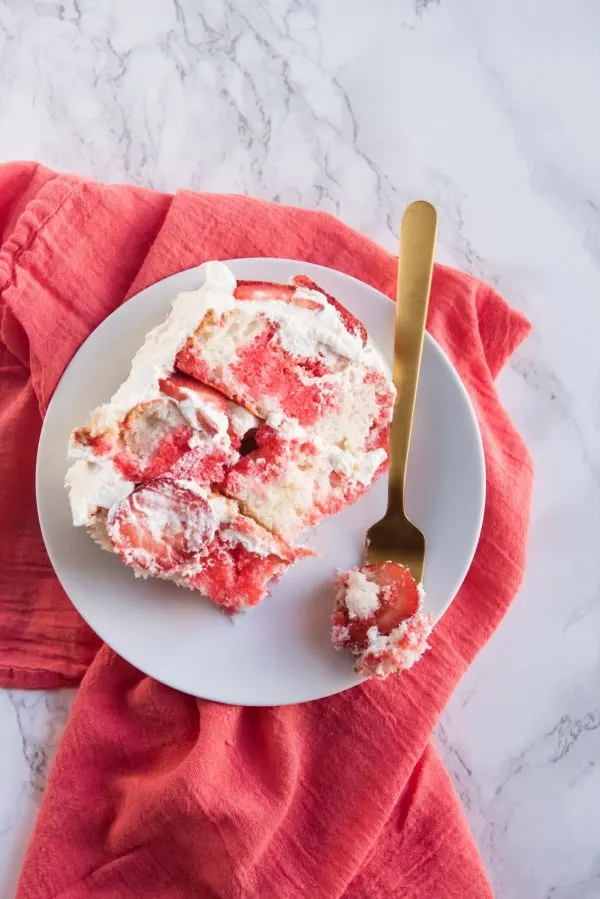 Strawberry Poke Cake with Berries + Cream | Birthday cake recipes, poke cake recipes, party appetizers, entertaining tips, birthday party ideas and more from @cydconverse