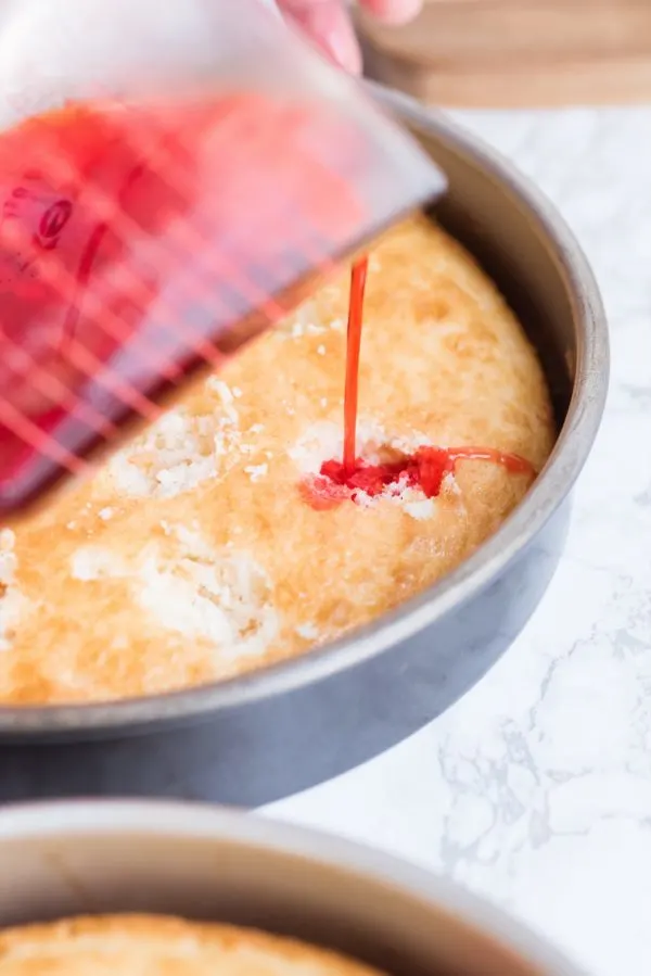 Strawberry Poke Cake with Berries + Cream | Birthday cake recipes, poke cake recipes, party appetizers, entertaining tips, birthday party ideas and more from @cydconverse