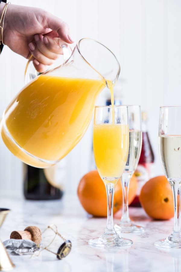 https://thesweetestoccasion.com/wp-content/uploads/2017/03/Tequila-Sunrise-Mimosa-Recipe-8-600x899.jpg