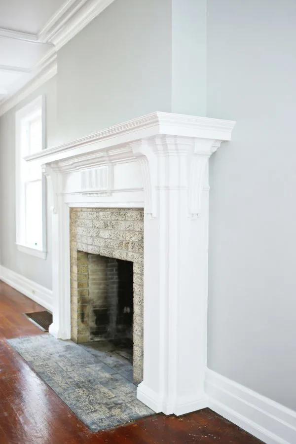 A Budget-Friendly DIY Fireplace Makeover for Under $30 | Easy home reno projects, fireplace ideas, tips for how to paint a fireplace and how to paint brick from @cydconverse