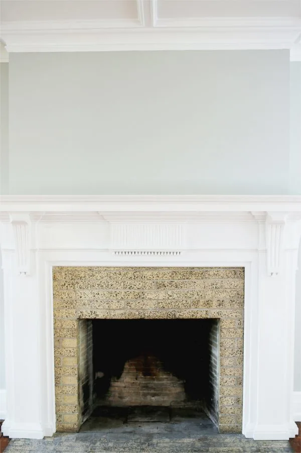 A Budget-Friendly DIY Fireplace Makeover for Under $30 | Easy home reno projects, fireplace ideas, tips for how to paint a fireplace and how to paint brick from @cydconverse