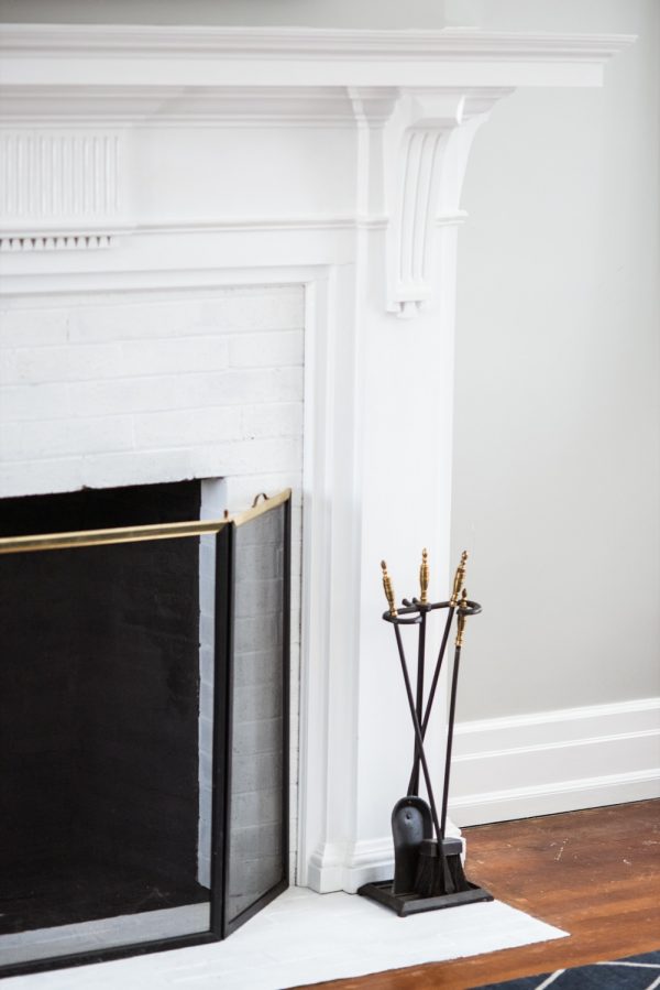 A Budget-Friendly DIY Fireplace Makeover for Under $30 | Easy home reno projects, fireplace ideas, tips for how to paint a fireplace and how to paint brick from @cydconverse