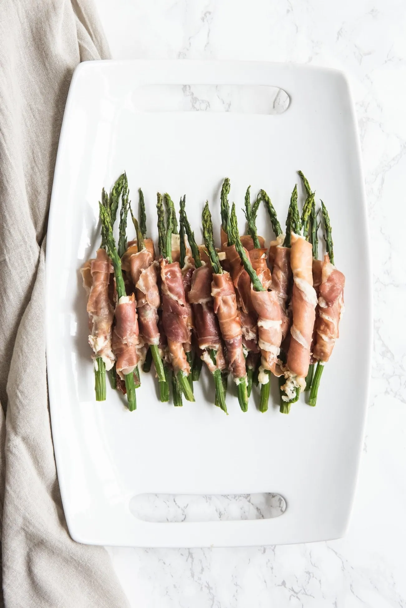 Prosciutto Wrapped Asparagus Recipe | Easy party appetizers, cocktail recipes, entertaining tips, party ideas and more from @cydconverse