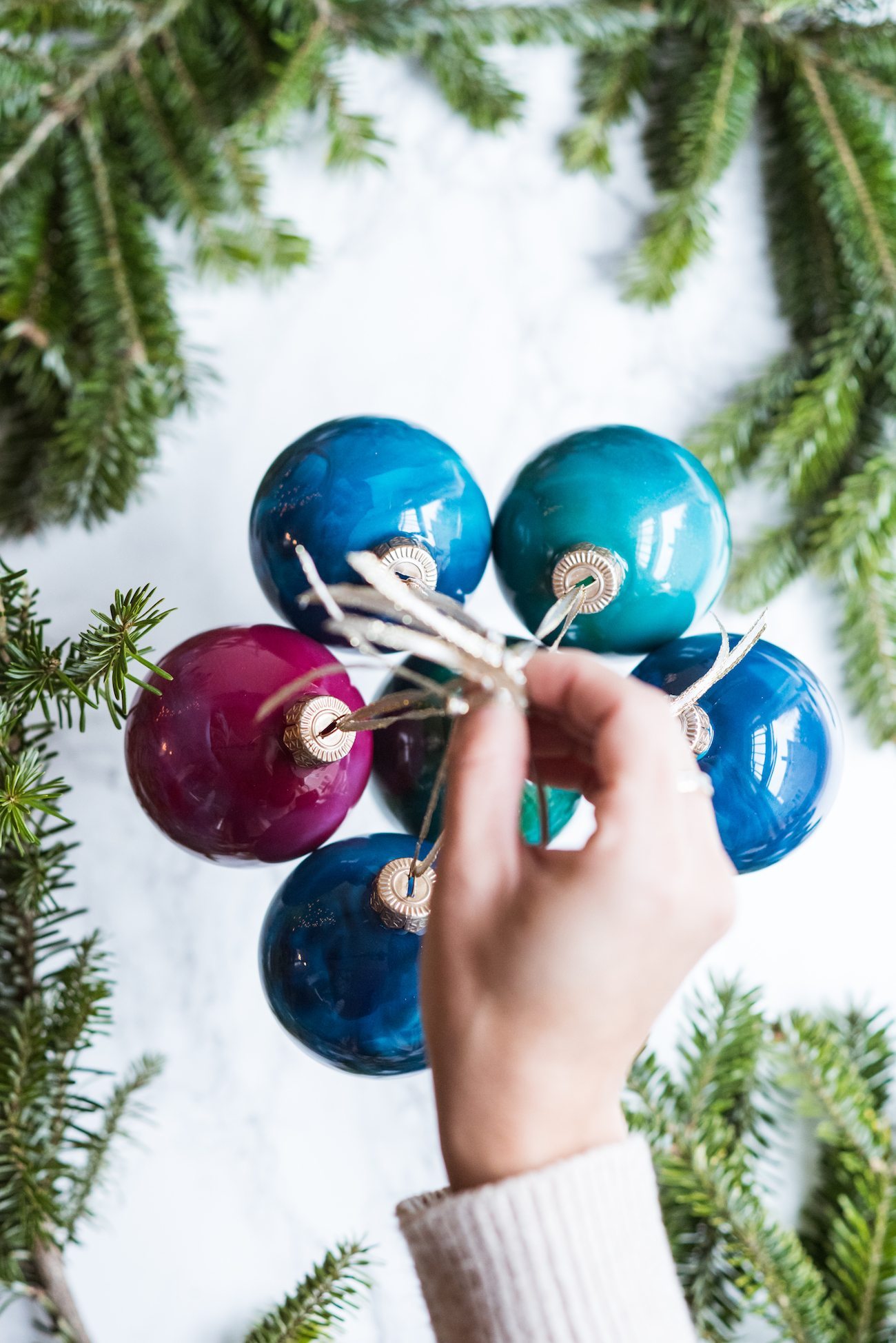 DIY Swirled Melted Crayon Ornaments | DIY ornaments, holiday entertaining tips, holiday cocktail recipes, homemade ornaments and more from @cydconverse