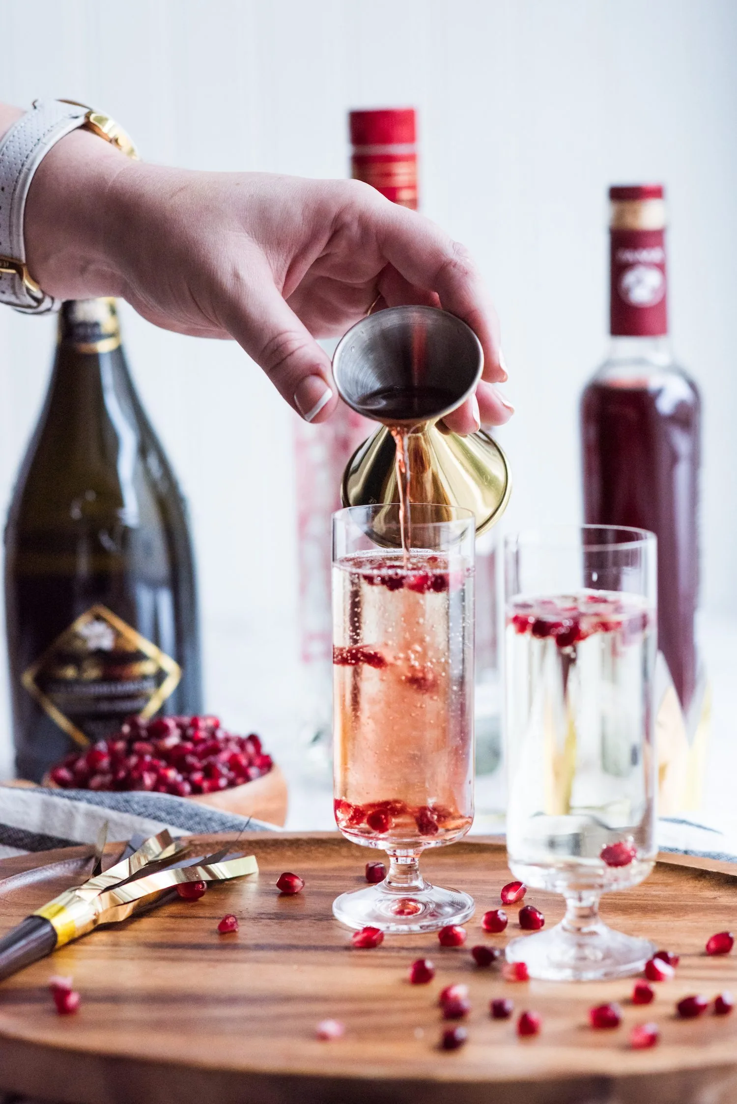 Sparkling Pomegranate French 75 Recipe | New Year's Eve cocktail recipes, entertaining tips, New Year's Eve party ideas and more from @cydconverse