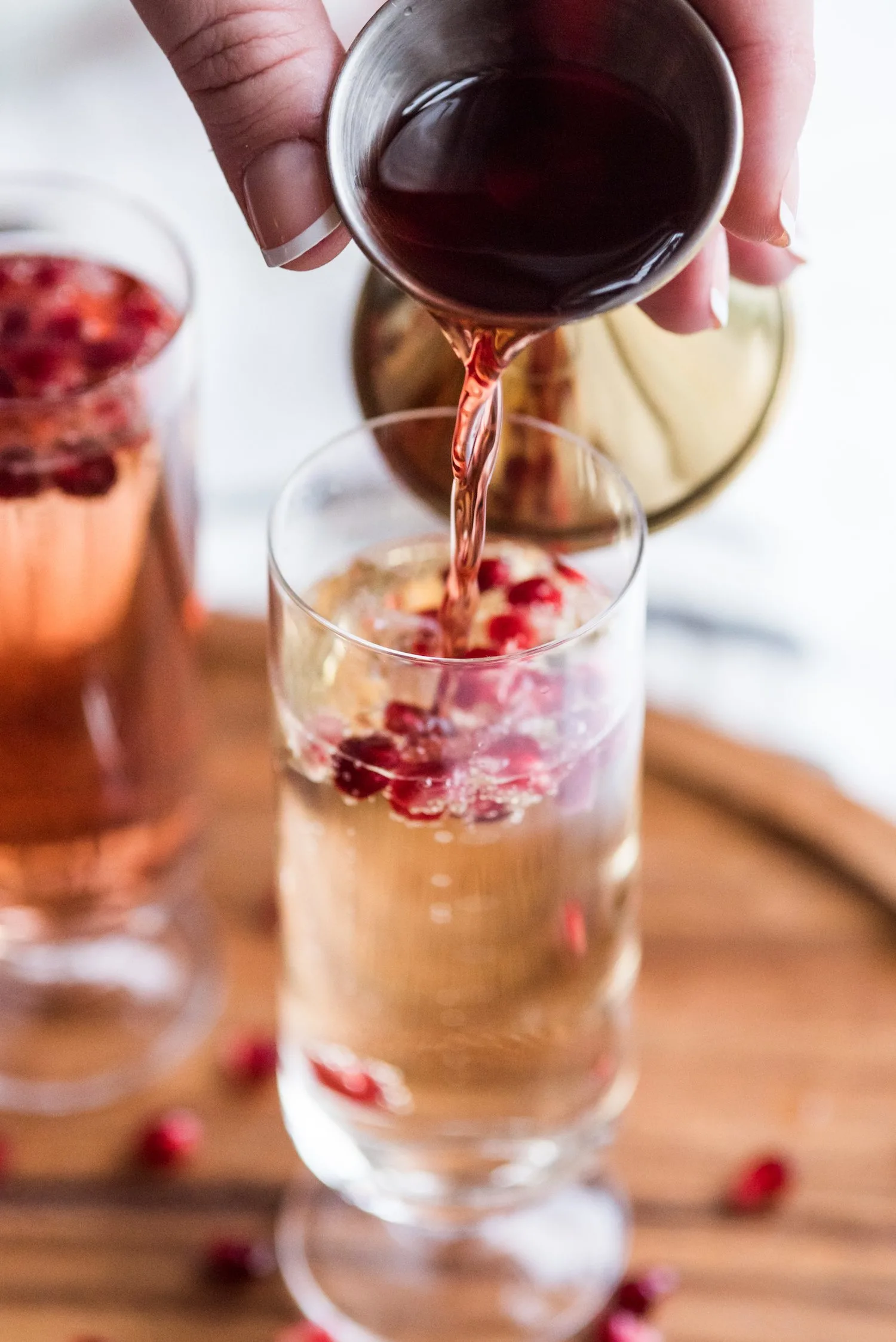 Sparkling Pomegranate French 75 Recipe | New Year's Eve cocktail recipes, entertaining tips, New Year's Eve party ideas and more from @cydconverse