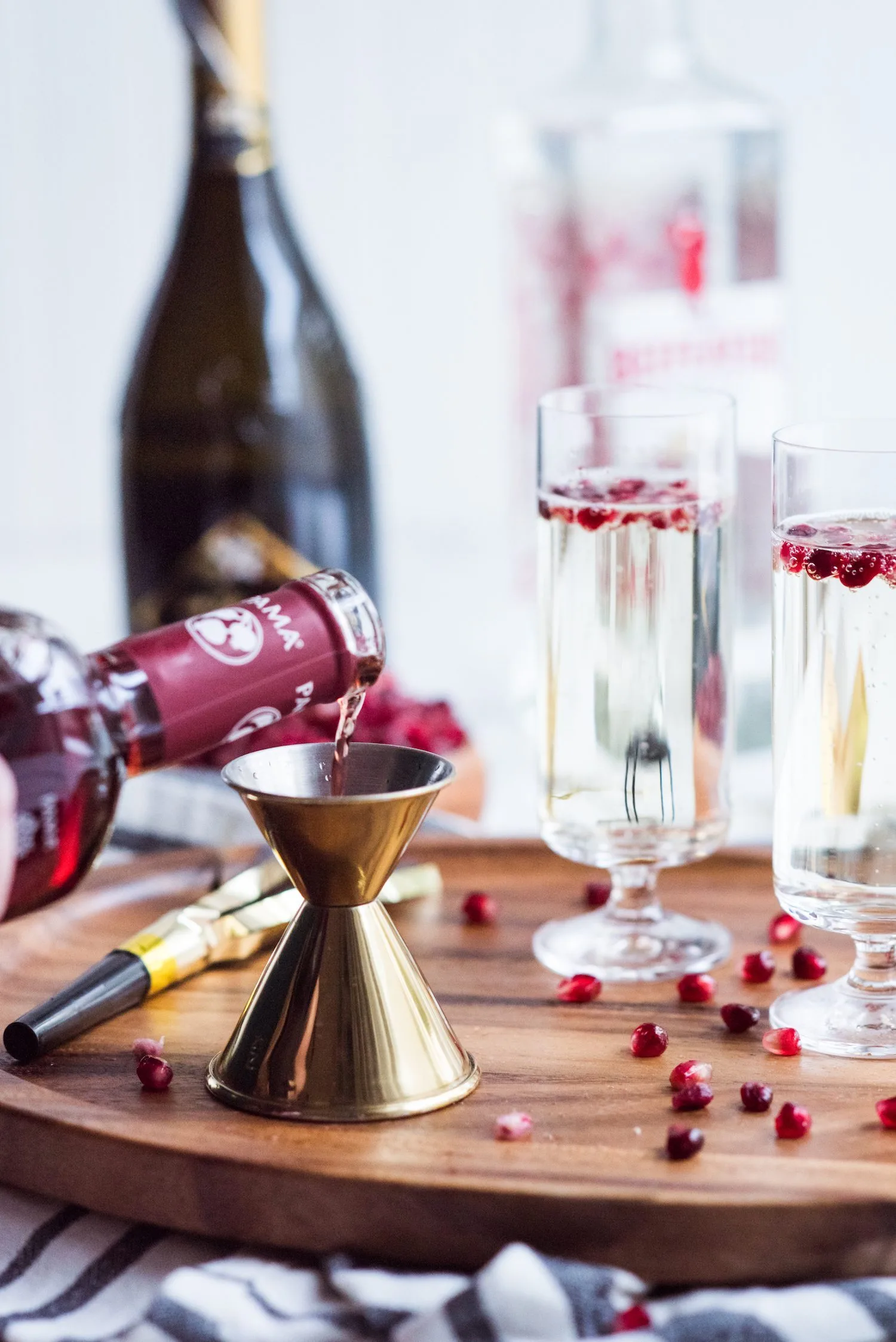 Sparkling Pomegranate French 75 Recipe | New Year's Eve cocktail recipes, entertaining tips, New Year's Eve party ideas and more from @cydconverse