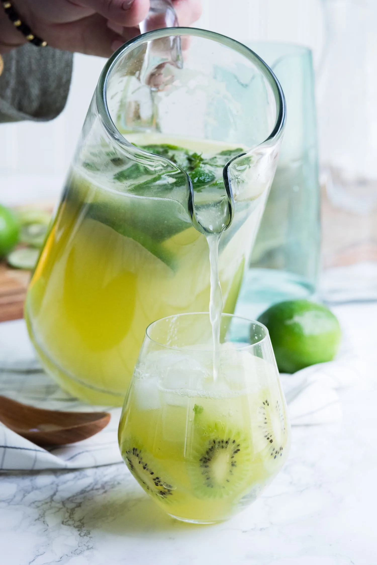 Kiwi Lime Mint Sangria Recipe | Click through for cocktail recipes, entertaining tips, party ideas, party recipes and more from @cydconverse