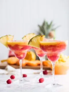 Raspberry Swirl Pineapple Mango Margaritas | Entertaining tips, cocktail recipes, party recipes and more from @cydconverse