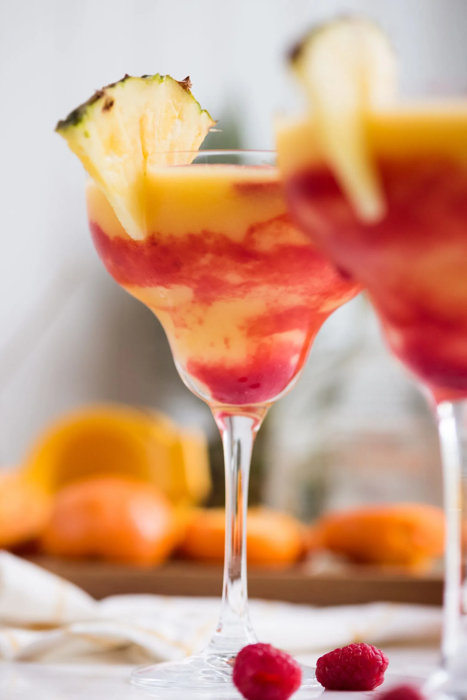 Raspberry Swirl Pineapple Mango Margaritas | Entertaining tips, cocktail recipes, party recipes and more from @cydconverse