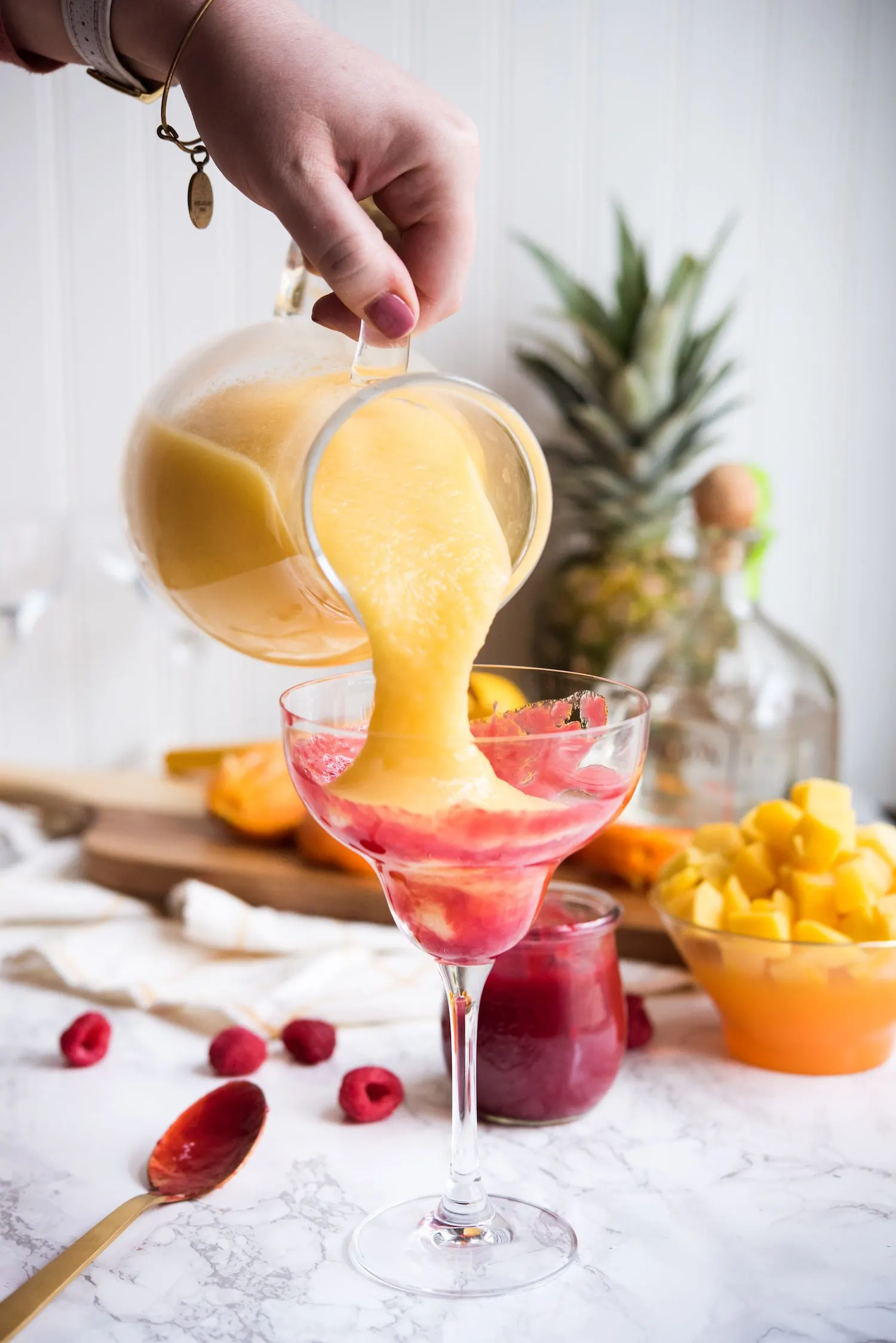 Raspberry Swirl Pineapple Mango Margaritas | Entertaining tips, cocktail recipes, party recipes and more from @cydconverse