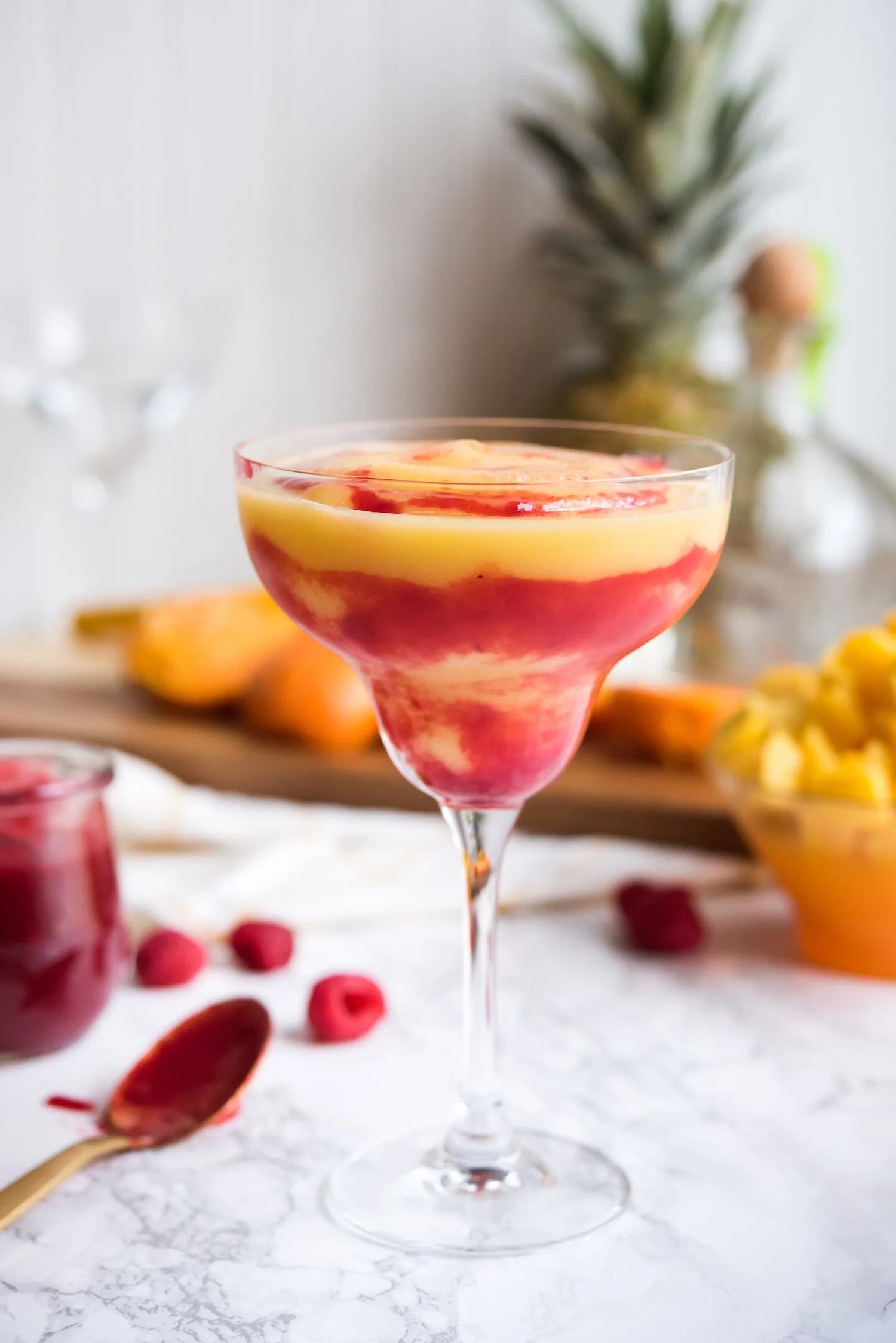 Raspberry Swirl Pineapple Mango Margaritas | Entertaining tips, cocktail recipes, party recipes and more from @cydconverse