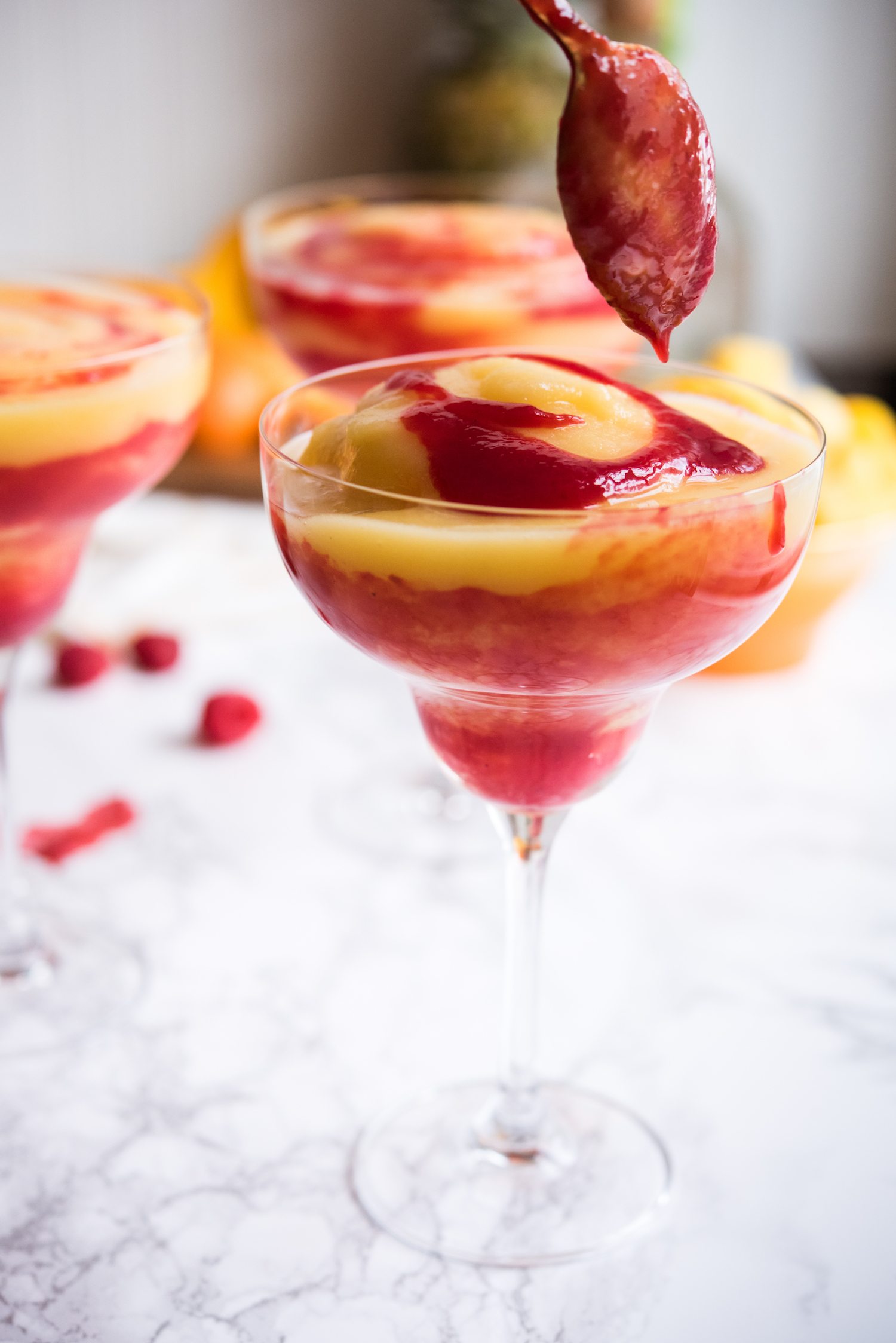 Raspberry Swirl Pineapple Mango Margaritas | Entertaining tips, cocktail recipes, party recipes and more from @cydconverse