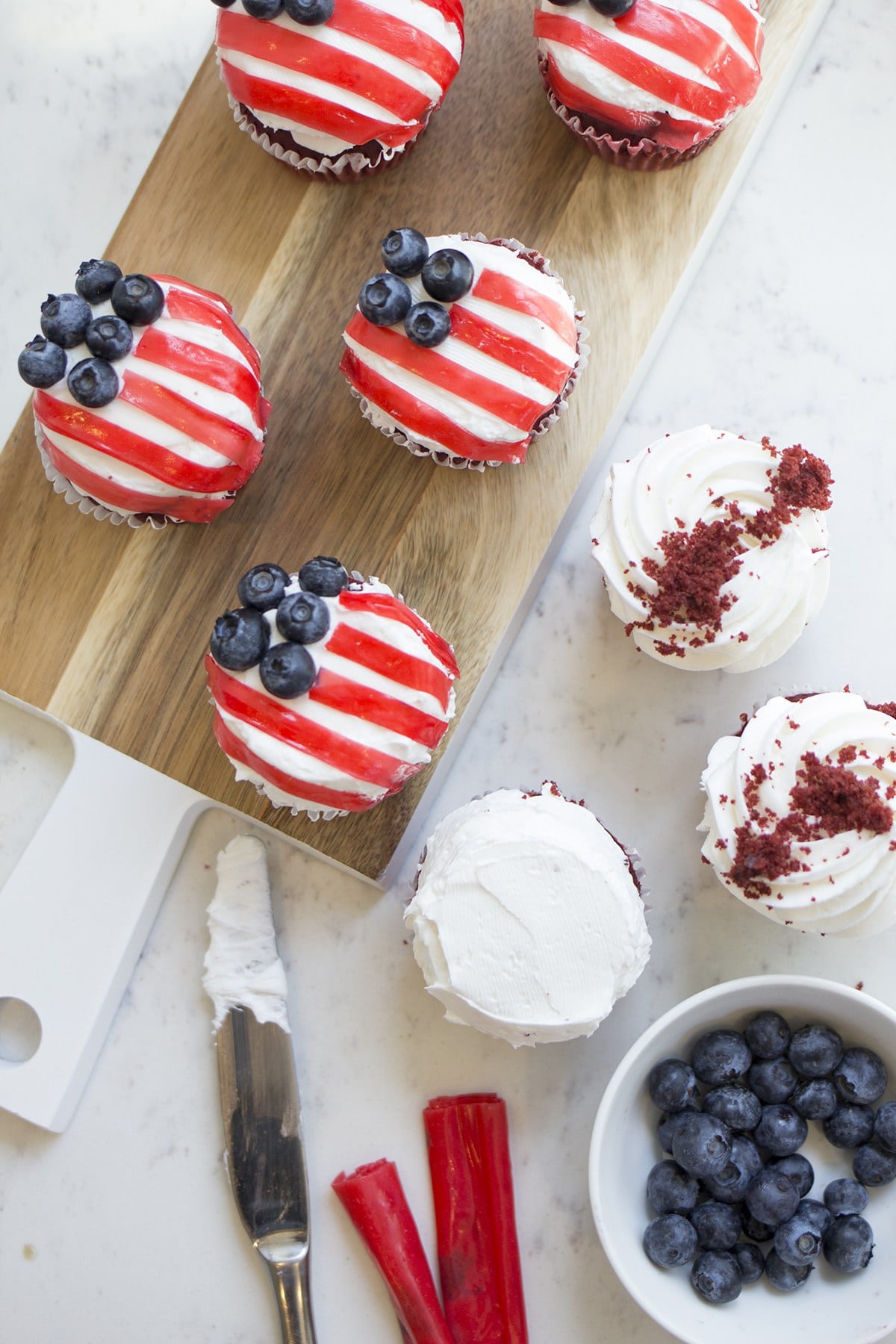 Red, White and Blue Cream Flag Cupcakes | 4th of July party ideas, 4th of July desserts and more from @cydconverse