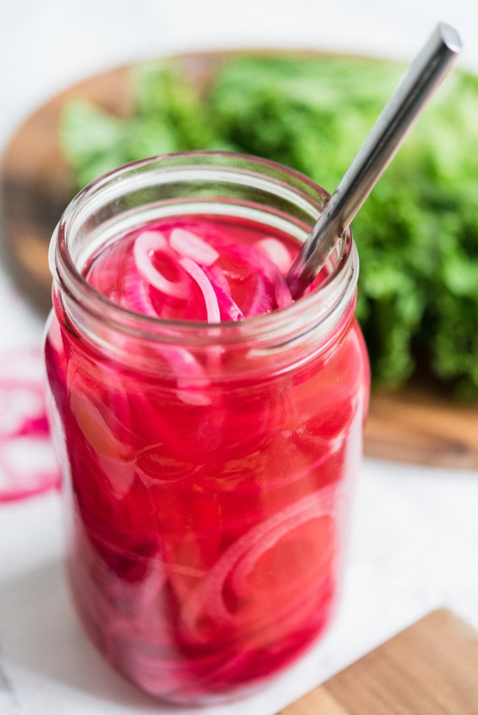 The best easy pickled red onions recipe! Visit The Sweetest Occasion for party ideas, party recipes, easy appetizer recipes and more!