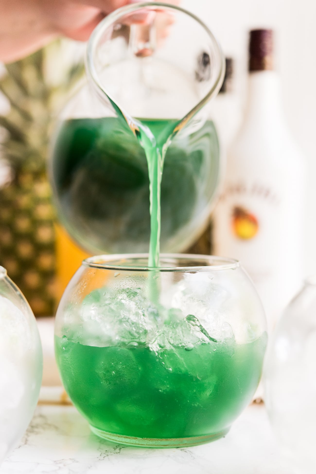 Mermaid Water Fish Bowl Drinks | Summer cocktail recipes, summer party ideas, recipes and more from entertaining blog @cydconverse
