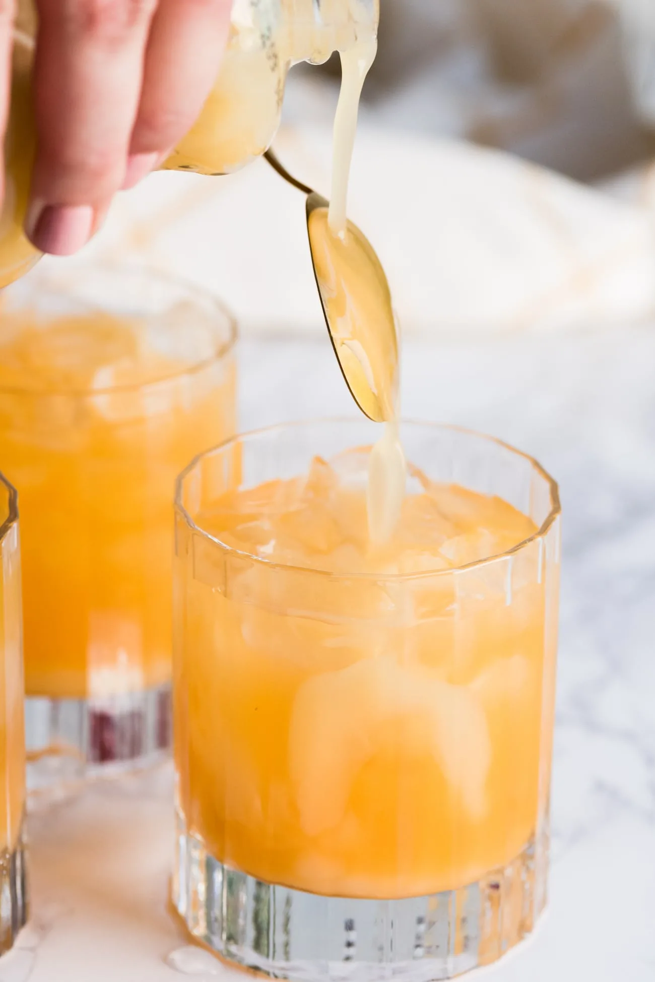 Mango Sunrise Piña Coladas from entertaining blog @cydconverse - Click through for entertaining tips, party ideas, recipes, cocktail recipes, party appetizers and more!