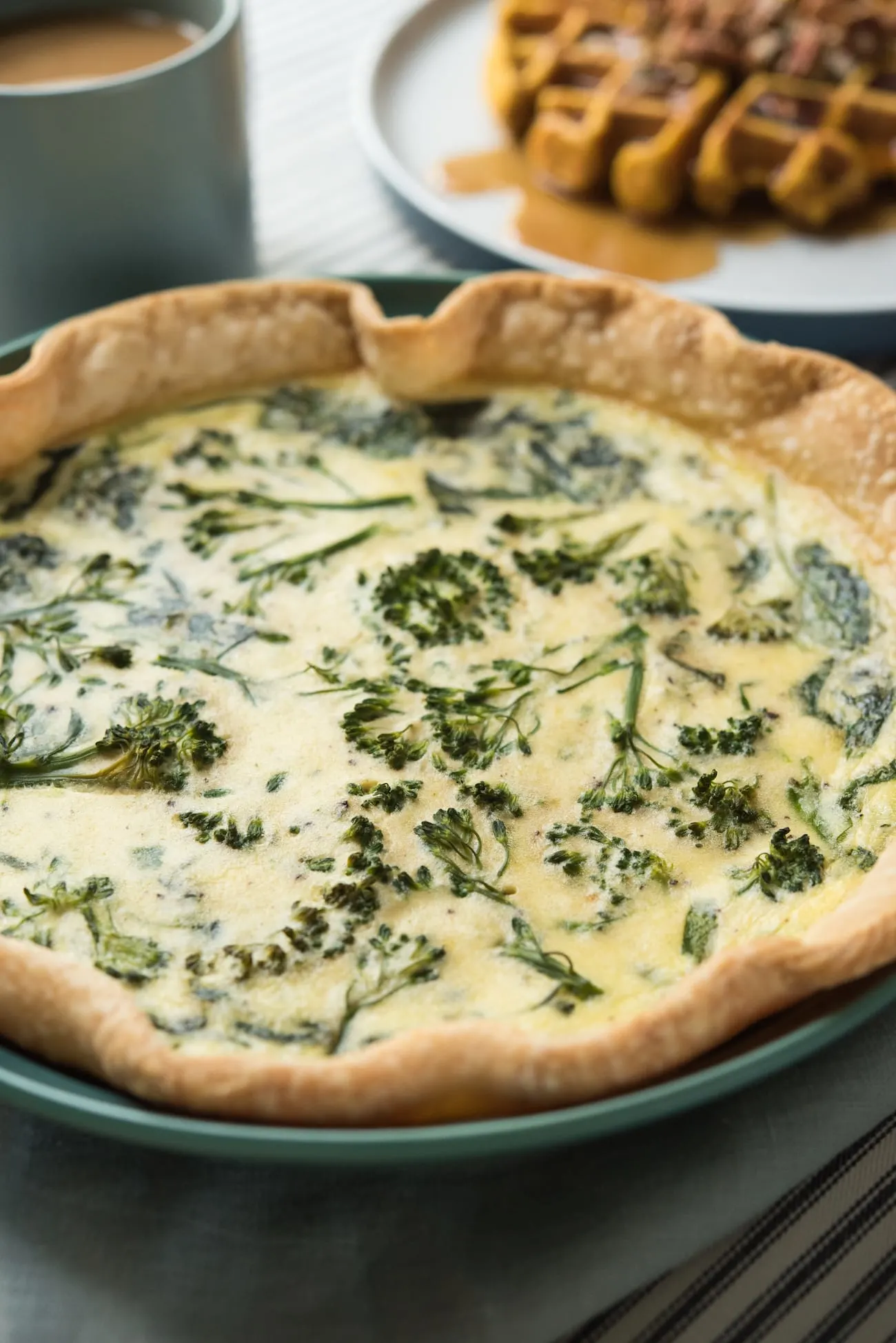 Spinach and Broccolini Goat Cheese Quiche | Friendsgiving recipes, Thanksgiving recipes, party ideas and entertaining tips from entertaining blog @cydconverse