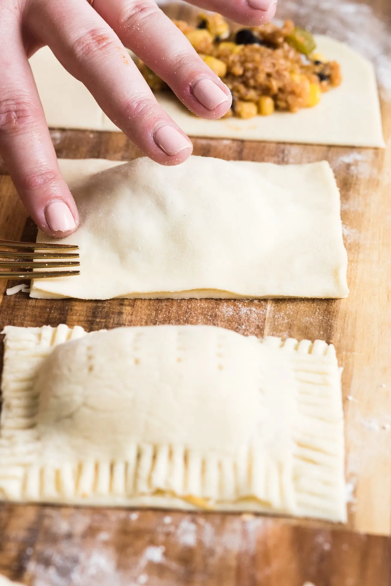 Make these crazy good homemade veggie taco pop tarts for your next game day party! Visit entertaining blog @cydconverse for the recipe