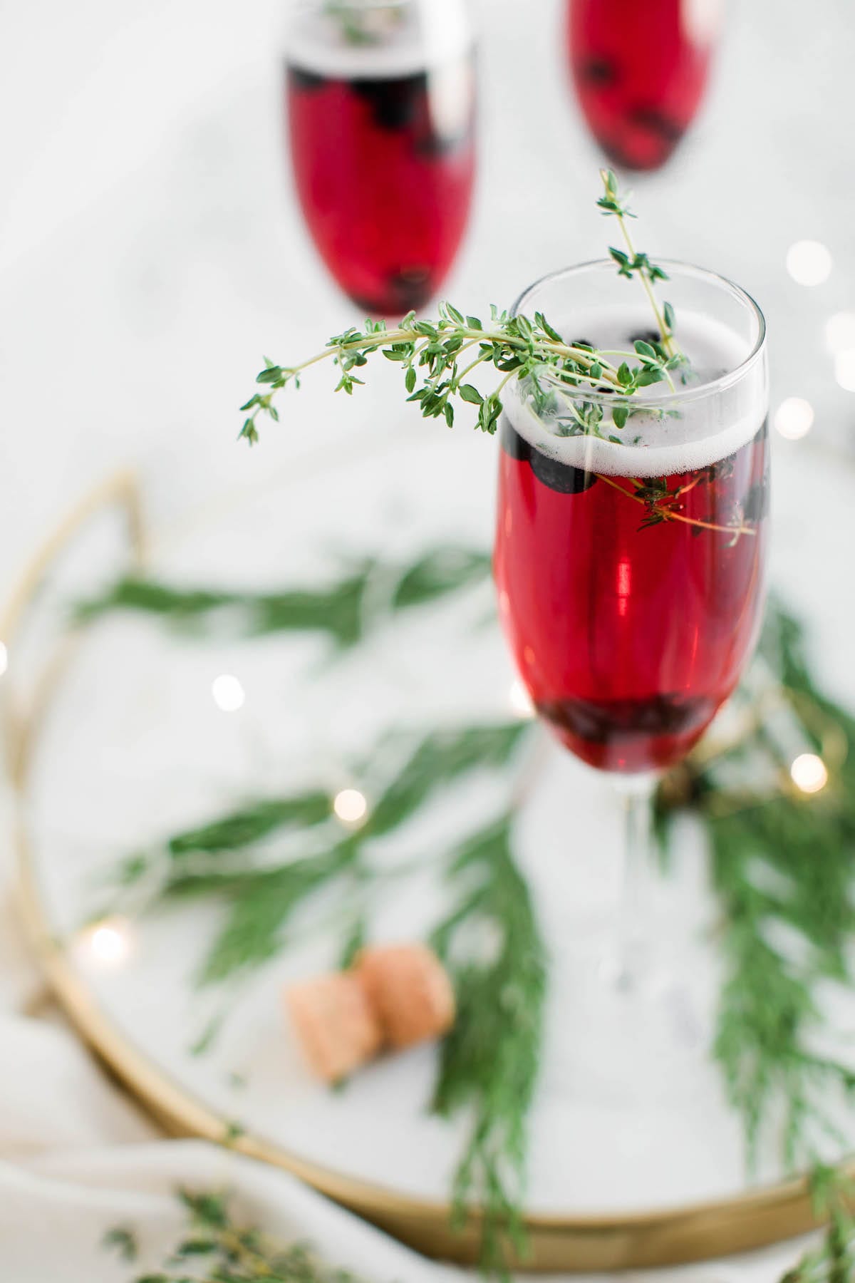 Champagne cocktails make the best Christmas cocktails! This blueberry bubbly sparkler is the perfect Christmas cocktail recipe. See more from entertaining blog @cydconverse!