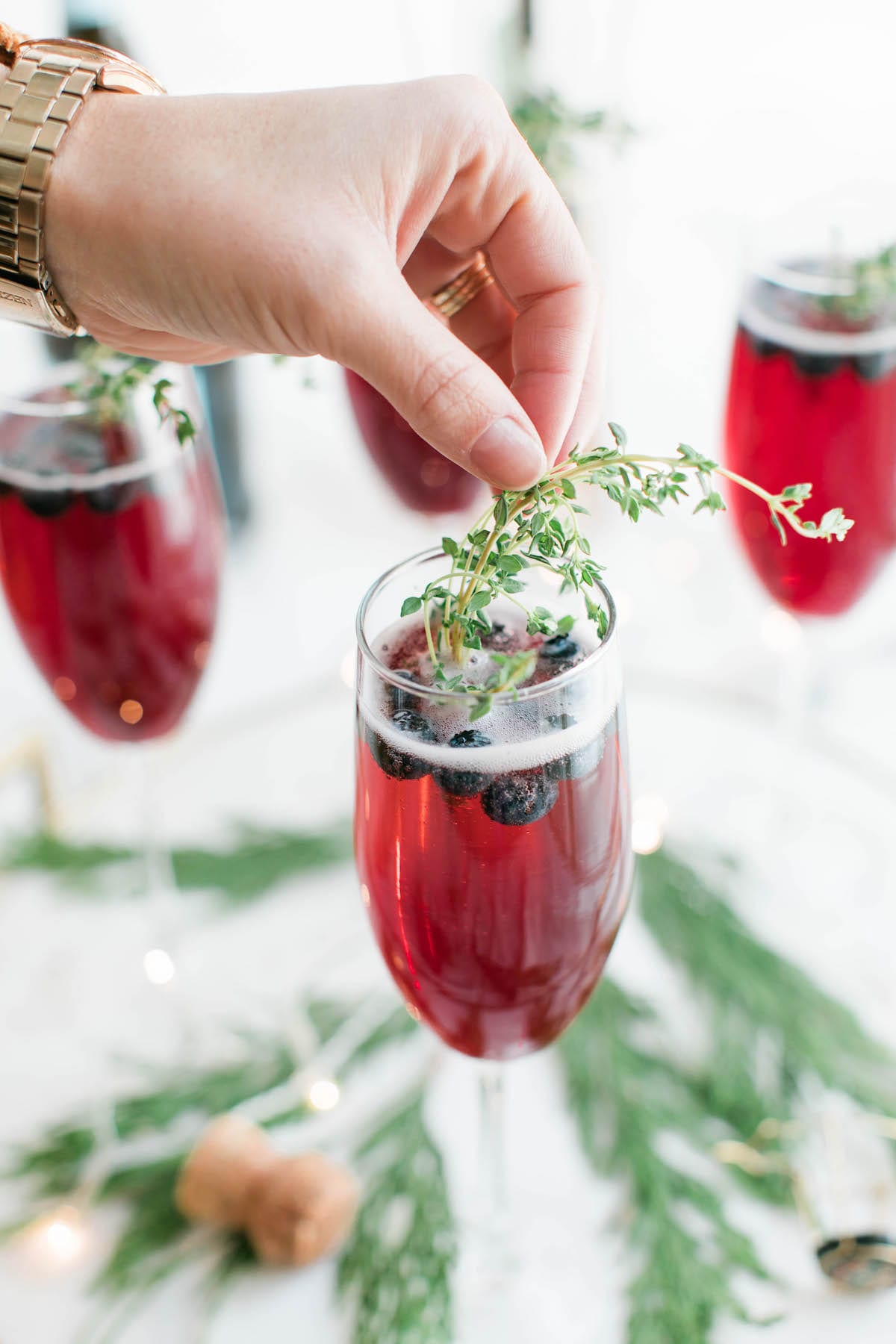 Champagne cocktails make the best Christmas cocktails! This blueberry bubbly sparkler is the perfect Christmas cocktail recipe. See more from entertaining blog @cydconverse!