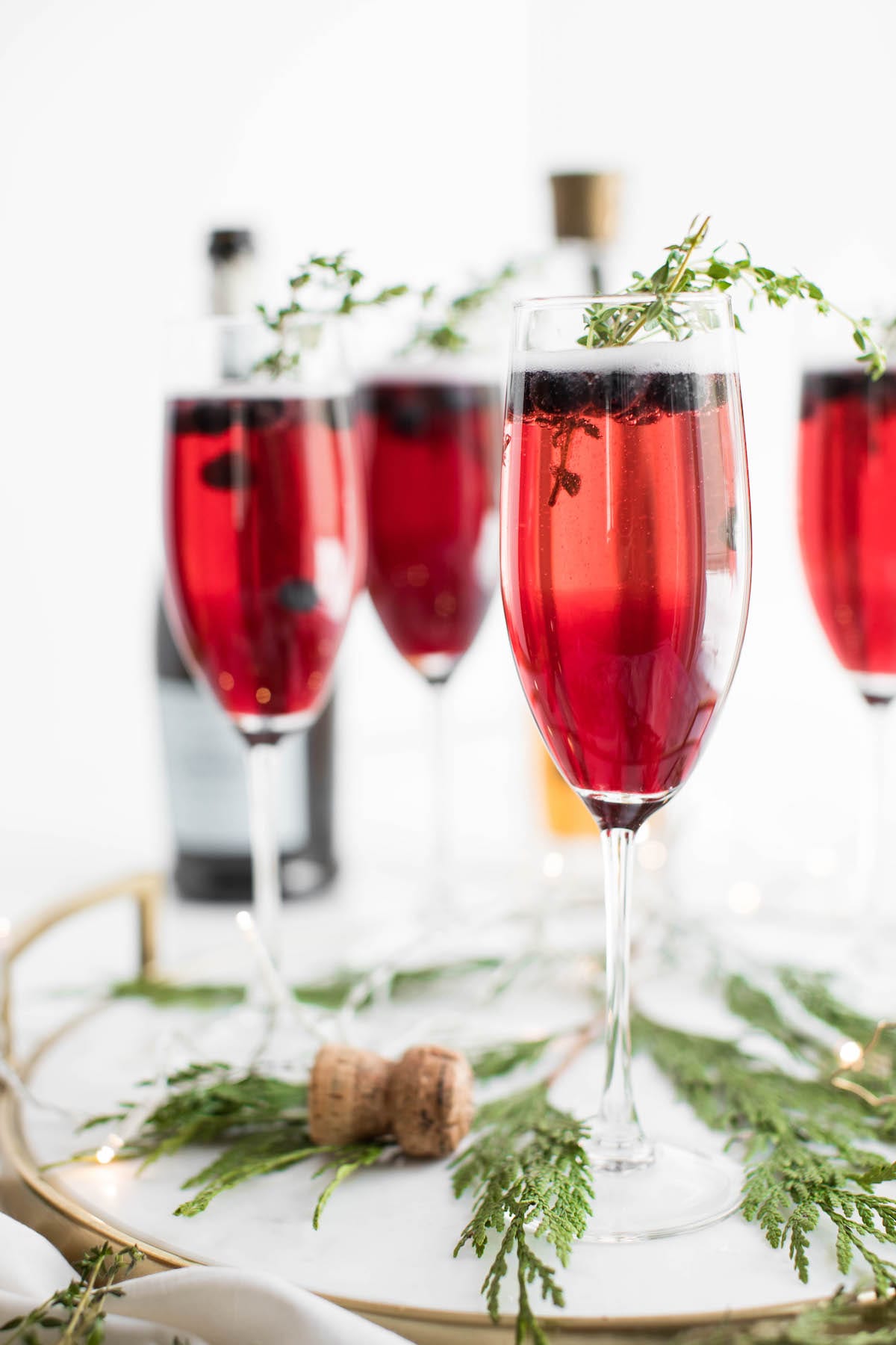 Champagne cocktails make the best Christmas cocktails! This blueberry bubbly sparkler is the perfect Christmas cocktail recipe. See more from entertaining blog @cydconverse!