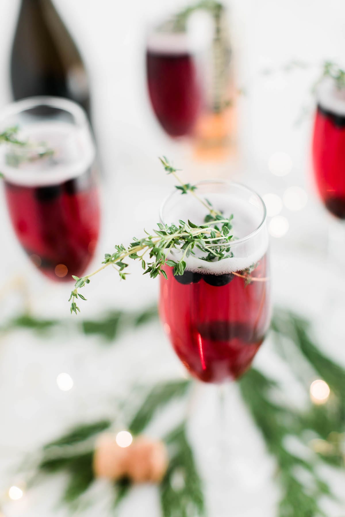 Champagne cocktails make the best Christmas cocktails! This blueberry bubbly sparkler is the perfect Christmas cocktail recipe. See more from entertaining blog @cydconverse!