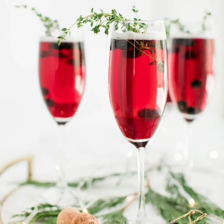 Champagne cocktails make the best Christmas cocktails! This blueberry bubbly sparkler is the perfect Christmas cocktail recipe. See more from entertaining blog @cydconverse!