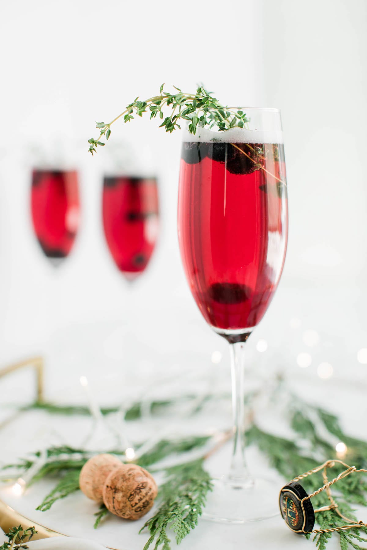 Champagne cocktails make the best Christmas cocktails! This blueberry bubbly sparkler is the perfect Christmas cocktail recipe. See more from entertaining blog @cydconverse!