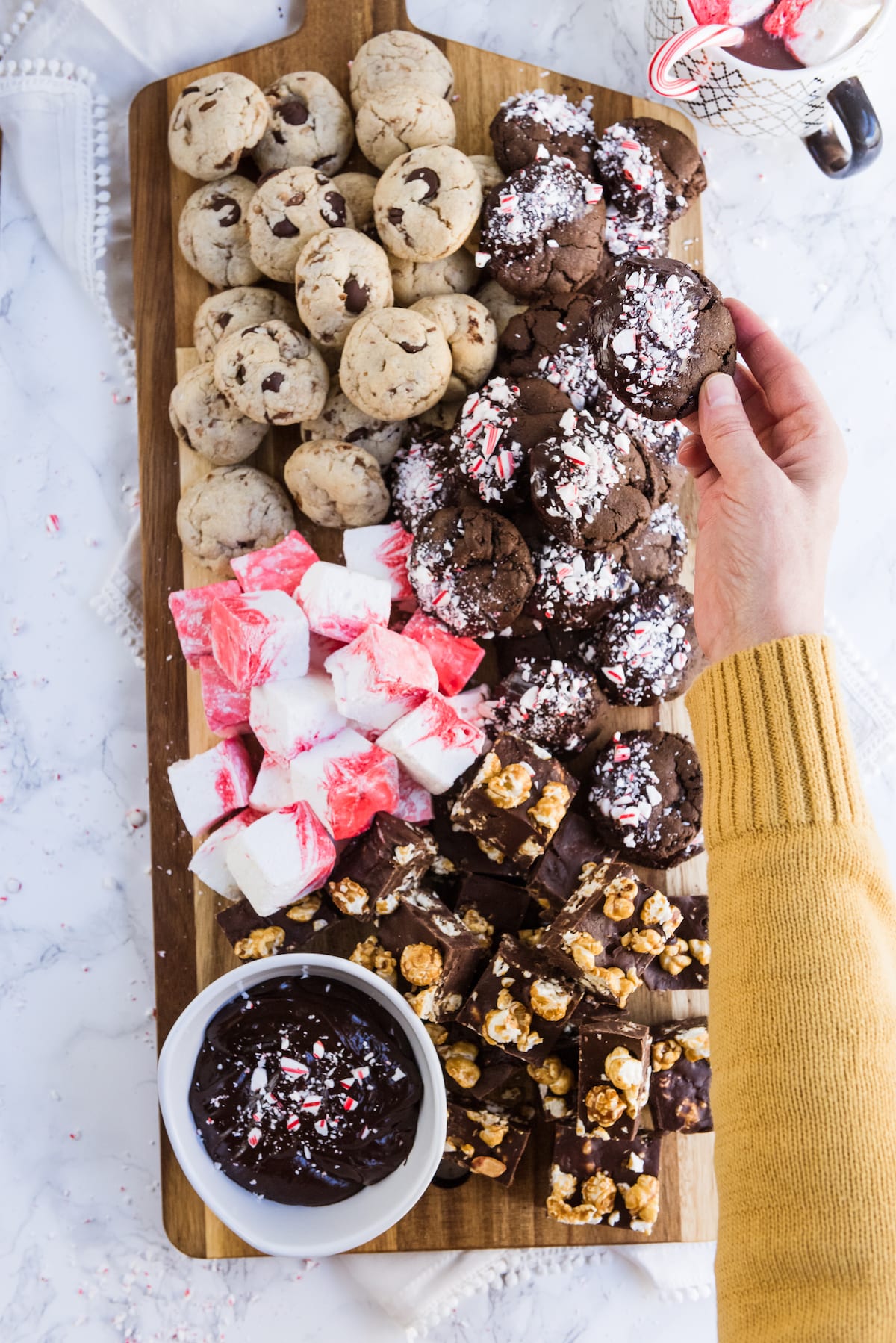 Elevate your yearly cookie platter game with an epic Christmas cookie board! Get the best Christmas cookie recipes, Christmas party ideas, entertaining tips, Christmas cocktails and more from entertaining blog @cydconverse
