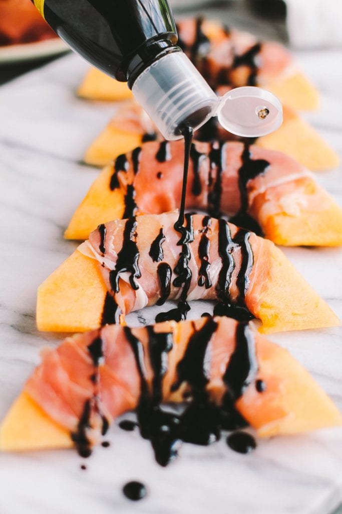 Prosciutto wrapped cantaloupe with balsamic glaze