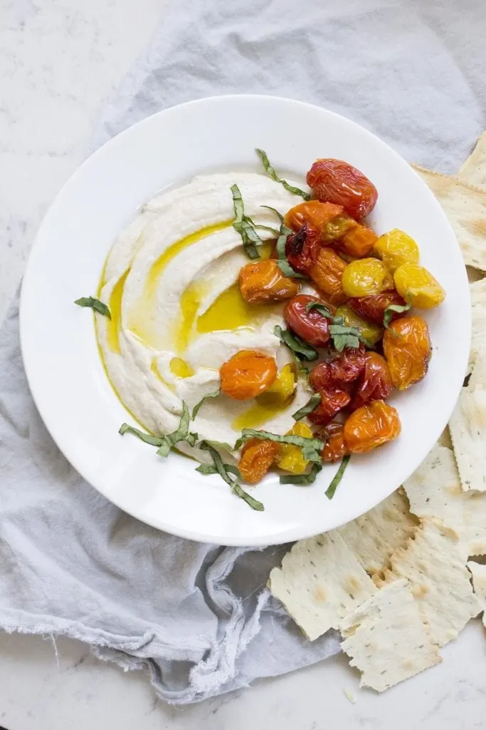 Ricotta and white bean dip with roasted tomatoes