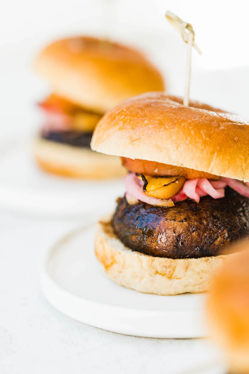 Grilled Portobello Burgers with Grilled Peaches + Pickled Red Onions | Easy grilling recipes for summer parties from @cydconverse
